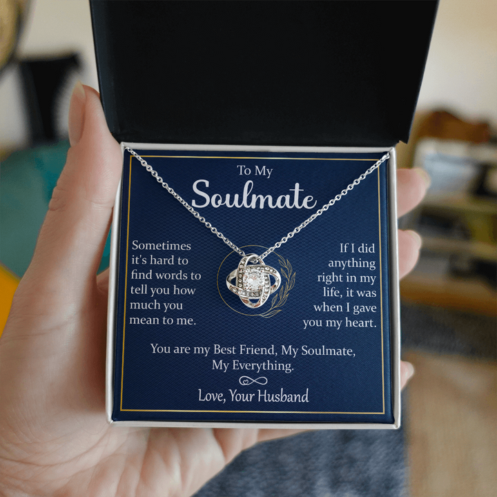 A gift box with a silver necklace and a heartfelt message.


