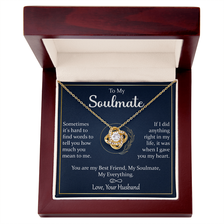 A gift box with a silver necklace and a heartfelt message.

