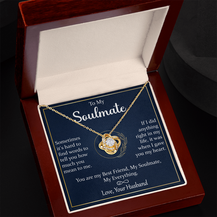 A gift box with a silver necklace and a heartfelt message.

