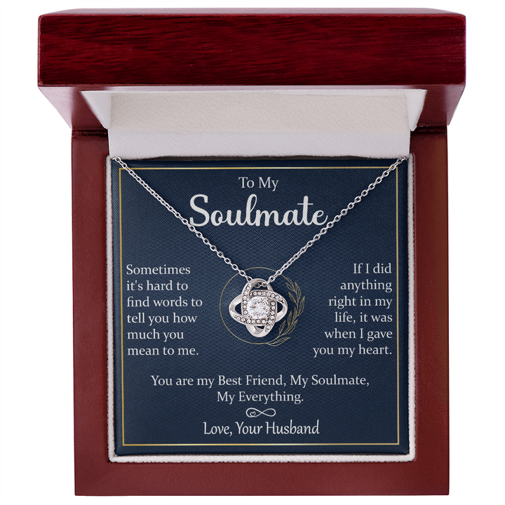 A gift box with a silver necklace and a heartfelt message.

