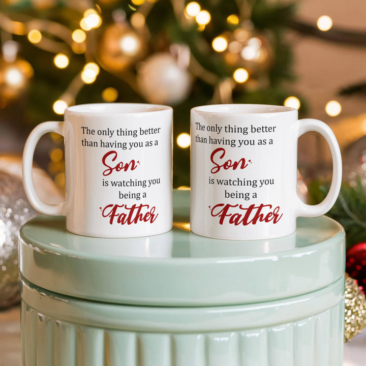 "White mug with ‘Son’ and ‘Father’ in red text"

