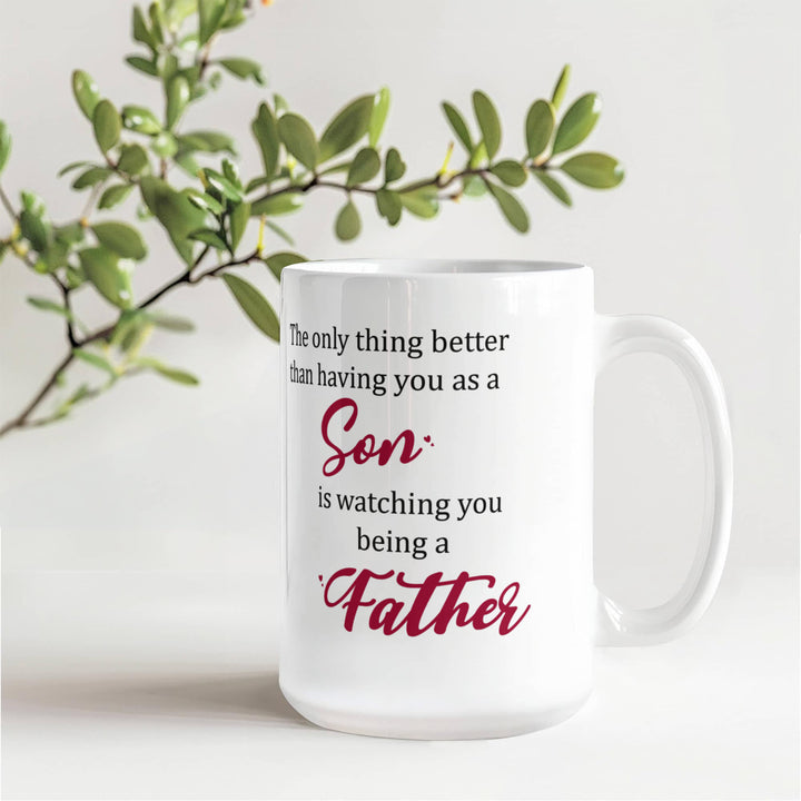 "White mug with ‘Son’ and ‘Father’ in red text"

