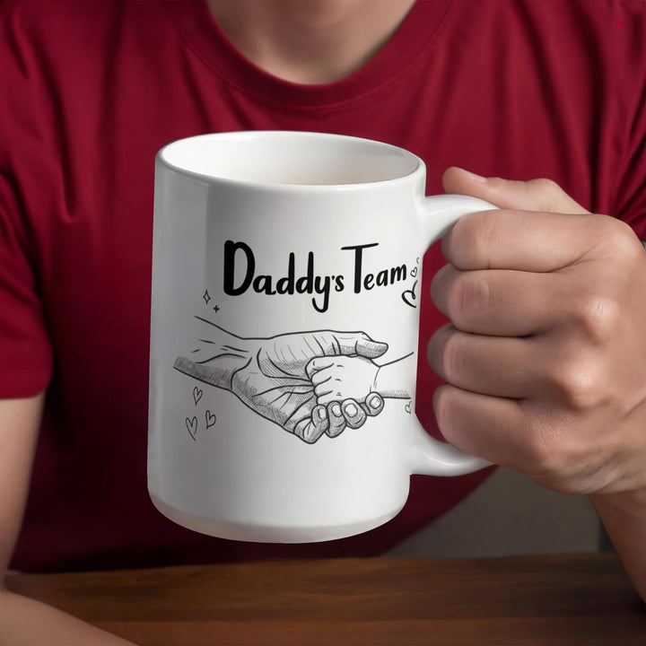 Father and baby hands on 'Daddy's Team' mug