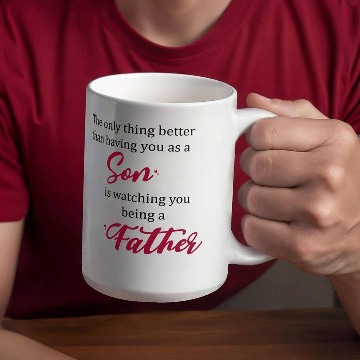 "White mug with ‘Son’ and ‘Father’ in red text"

