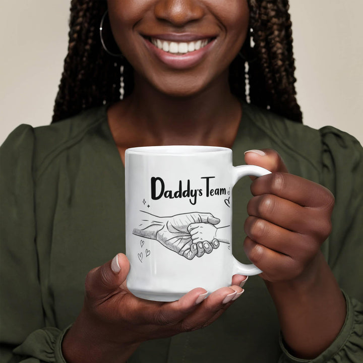 "White mug showing dad and child hand in hand"